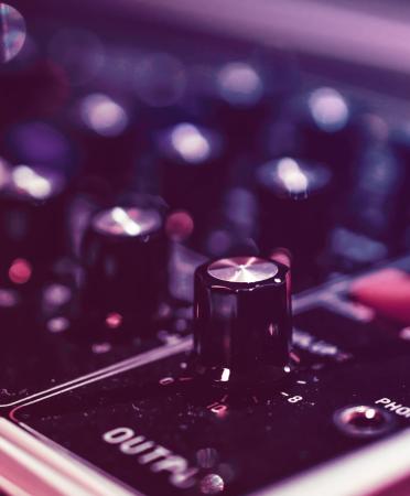 Audio mixer close-up photo by Alexandre Debiève (Unsplash)