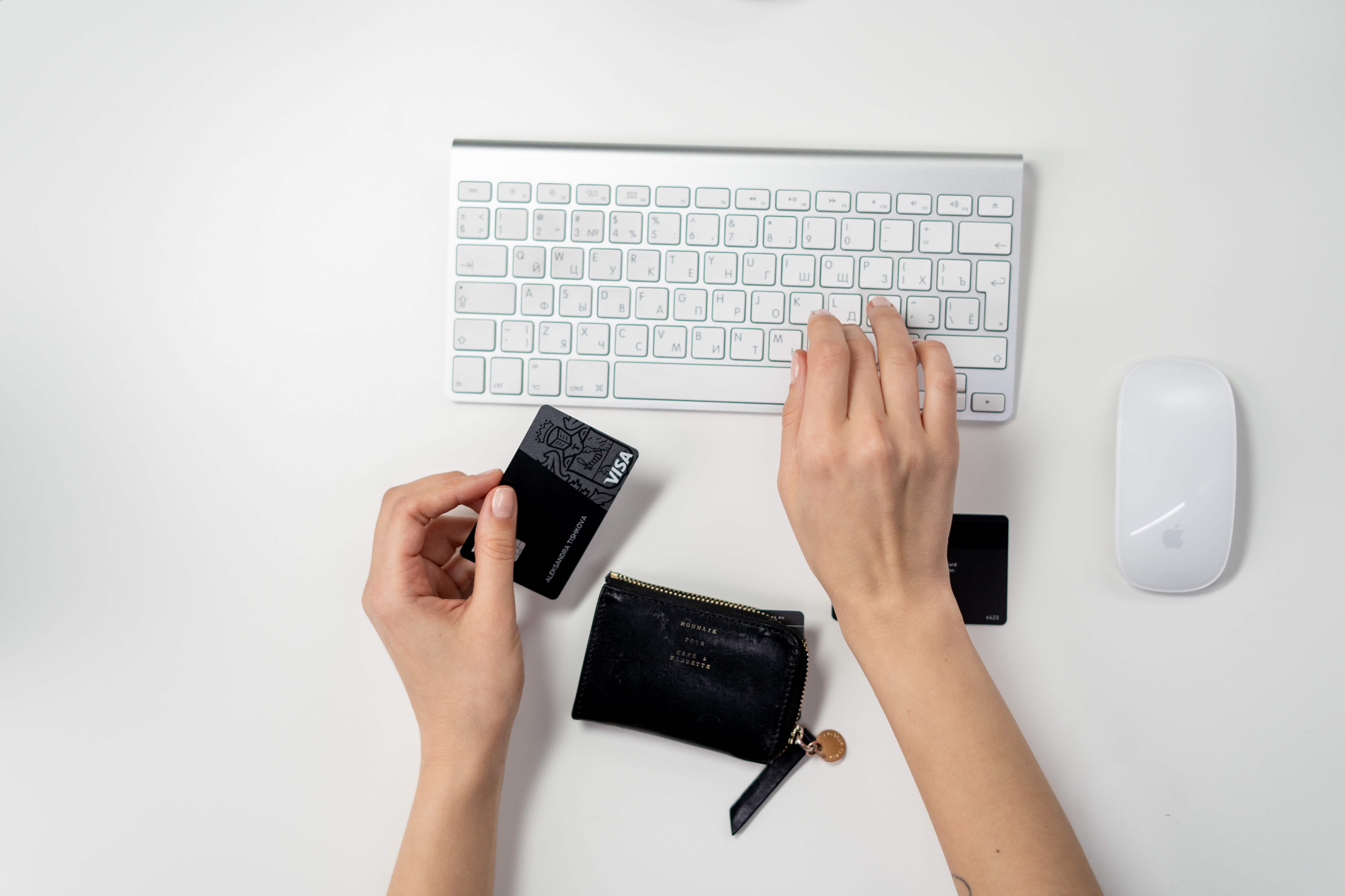 Ecommerce Website - woman holding credit card in front of laptop