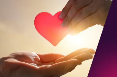 A picture of someone handing another hand a presumed paper cut out of a heart