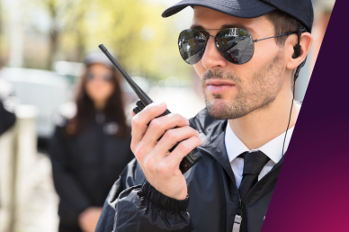 A picture of a security guard using a "walkie-talkie"