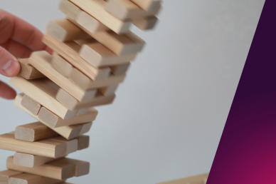 A picture of a jenga ( block stacking game ) tower falling