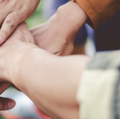 A group of people holding hands