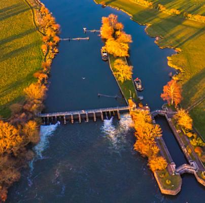 Aerial photography of river and open field during daytime photo by Lawrence Hookham on Unsplash