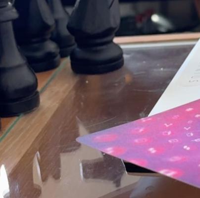 Wooden chess pieces set up on a board, symbolizing business strategy planning for corporate growth.