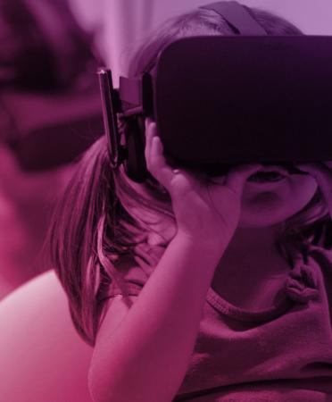 A girl using VR goggles