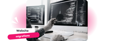 A professional pointing at a computer screen filled with code, symbolising the technical intricacies of website migrations Expert Website Migrations
